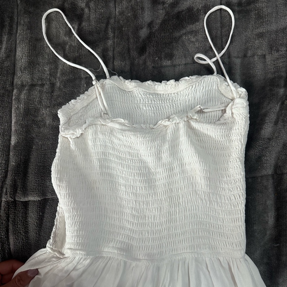 Beautiful white beach jumpsuit with wide leg flare light color bottoms